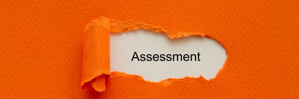 torn paper revealing the word assessment symbolising nutritional assessment process