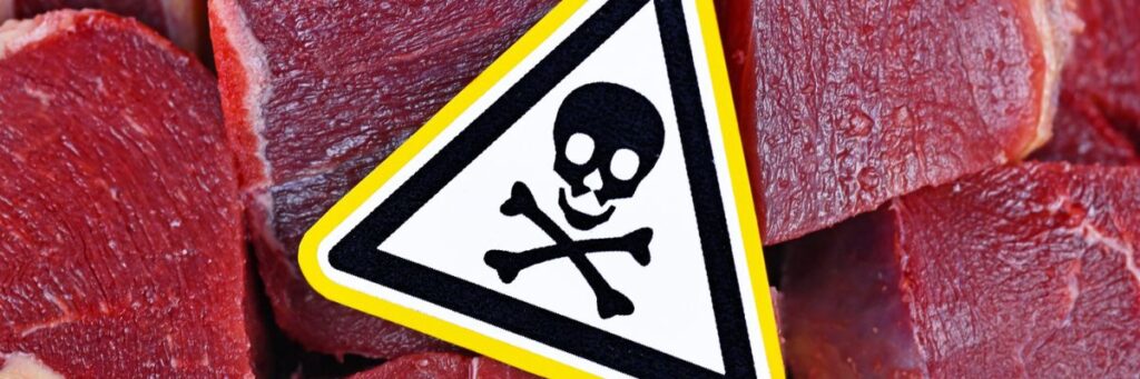 Harmful food combinations warning sign placed on raw meat showing toxic pairing risks