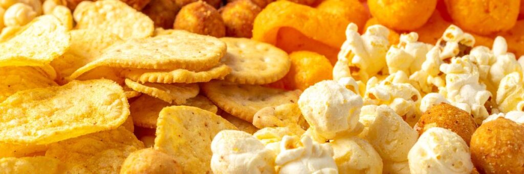 Assortment of fried and processed indian snacks showing unhealthy snack choices